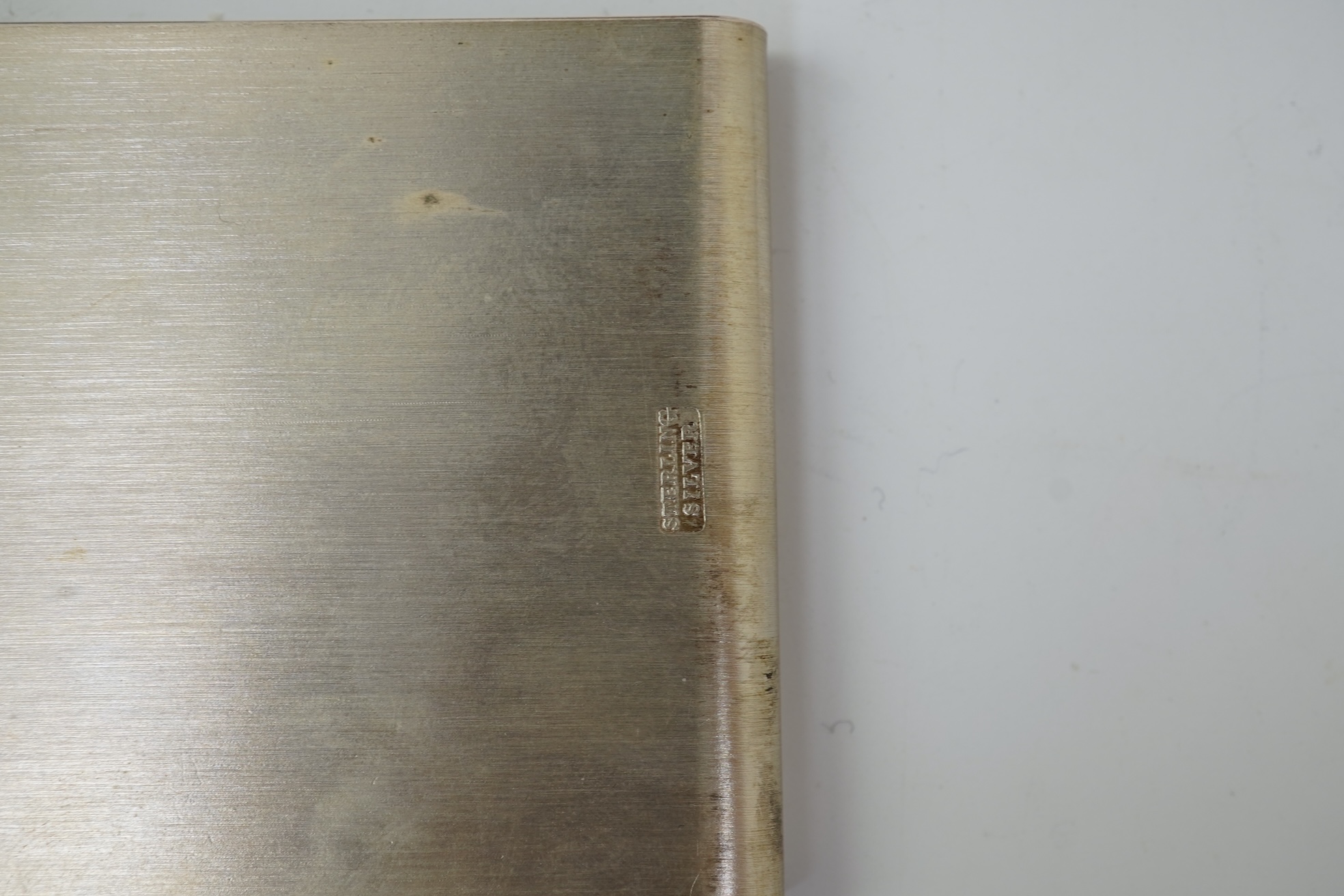 A pair of Elizabeth II silver money clips by Adrian Gerald Benney